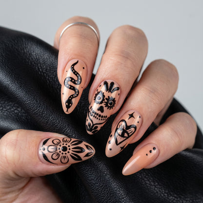 Black Ink Sugar Skull Press On Nails — Ink Grin | Hand-Painted Sheer Nude Almond Set
